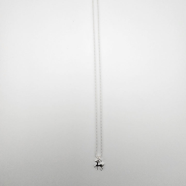 Sterling silver horse necklace by Bessie Bae on a fine silver beaded chain.