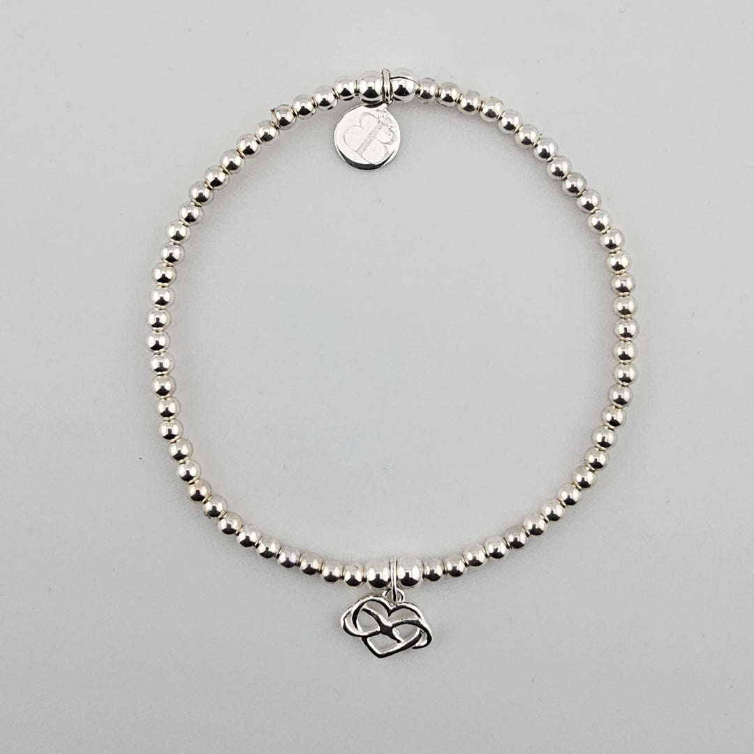 Sterling Silver Interlocking Hearts Bracelet by Bessie Bae.
