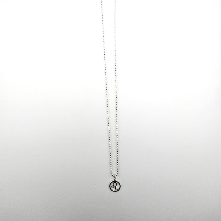 Sterling silver Leo zodiac necklace on a light background