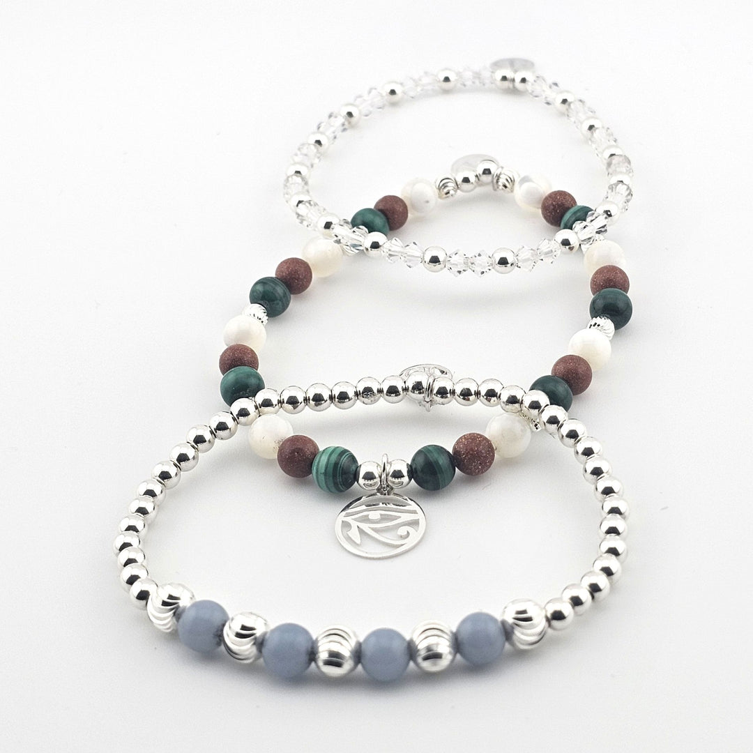 Bessie Bae handmade sterling silver beaded bracelets with green, brown, white and clear semi-precious gemstones.