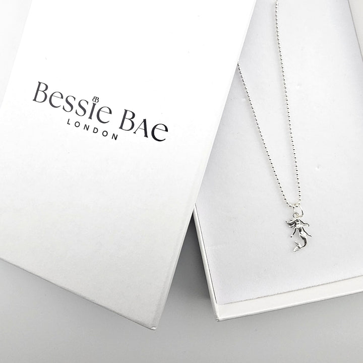 Sterling silver mermaid pendant necklace presented with Bessie Bae packaging.