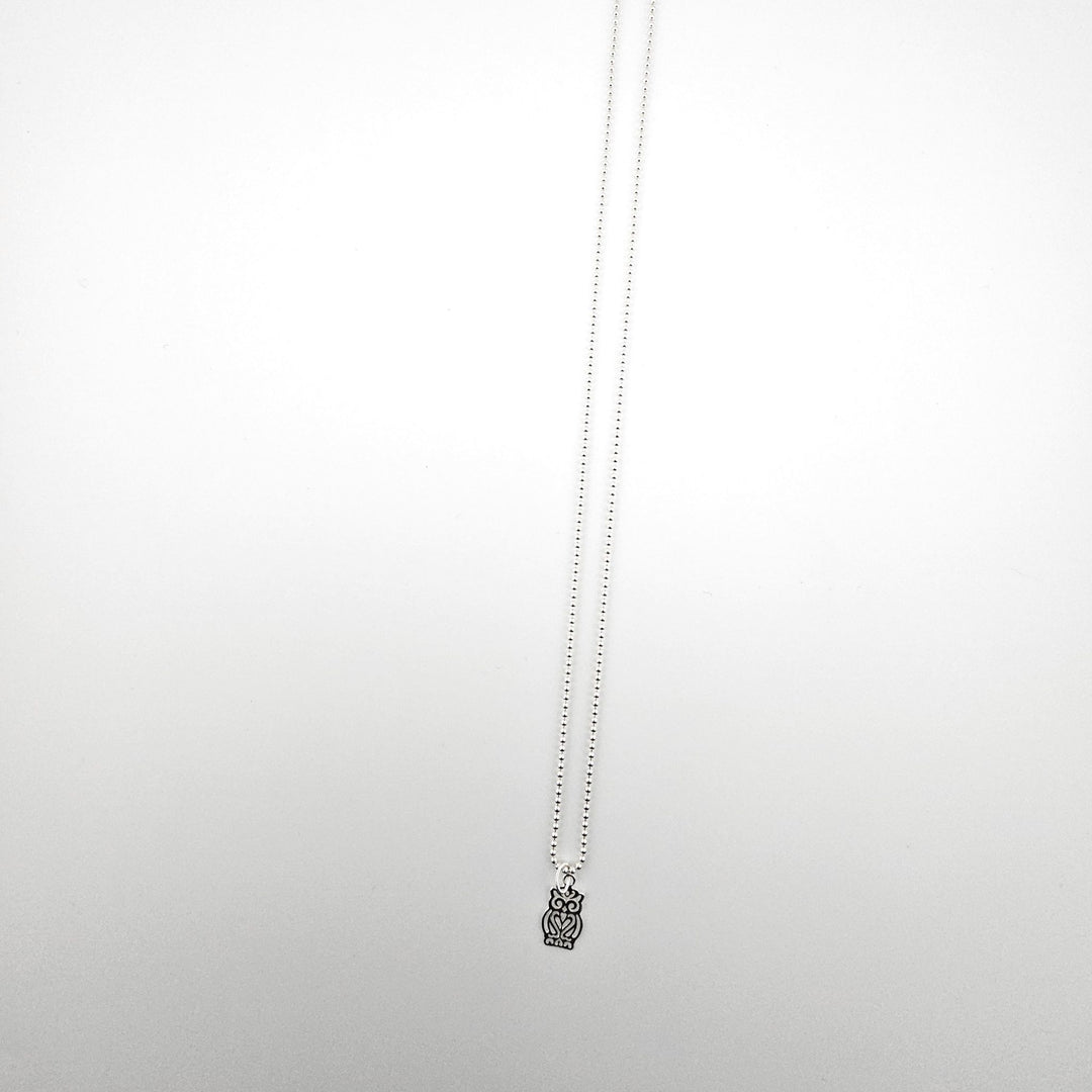 Sterling silver owl charm necklace on an 18 inch ball chain against a white background.