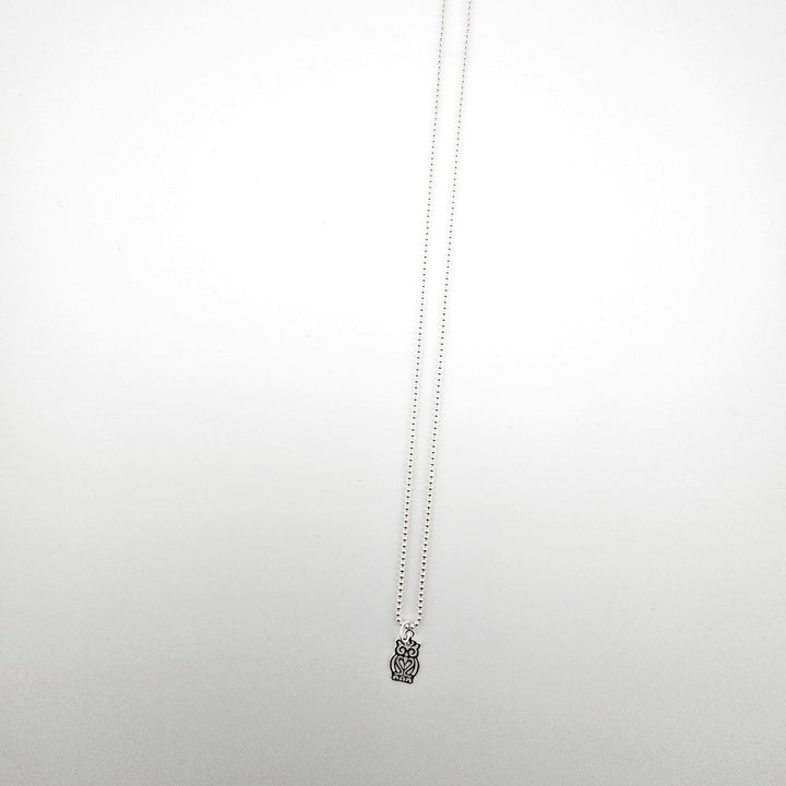 Sterling silver owl charm necklace on an 18 inch ball chain against a white background.
