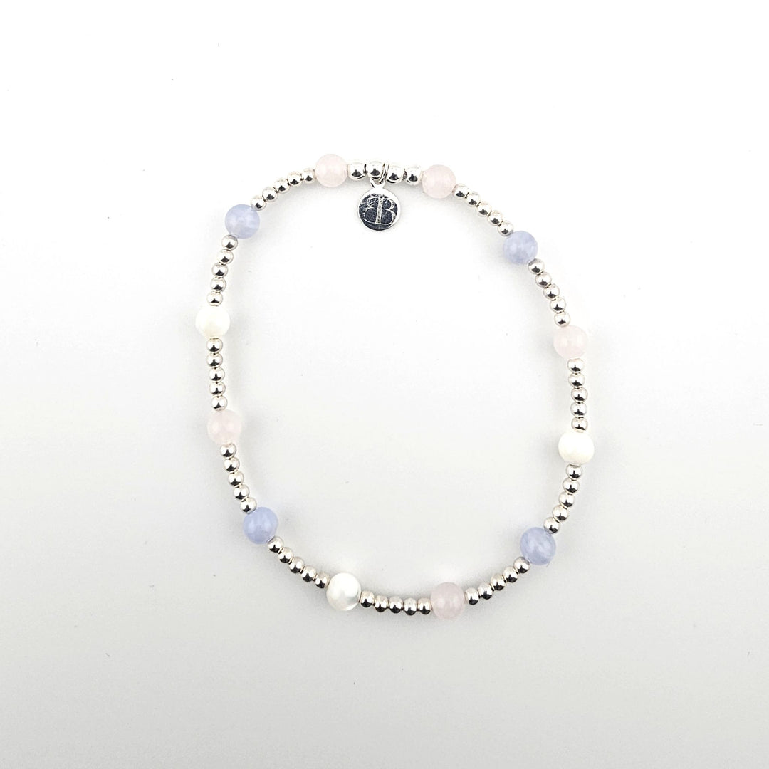 Sterling silver anklet with pastel gemstones by Bessie Bae.