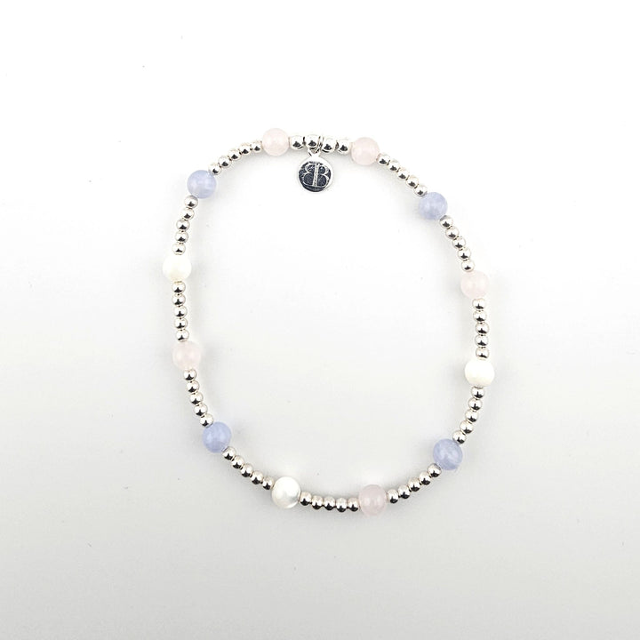 Sterling silver anklet with pastel gemstones by Bessie Bae.