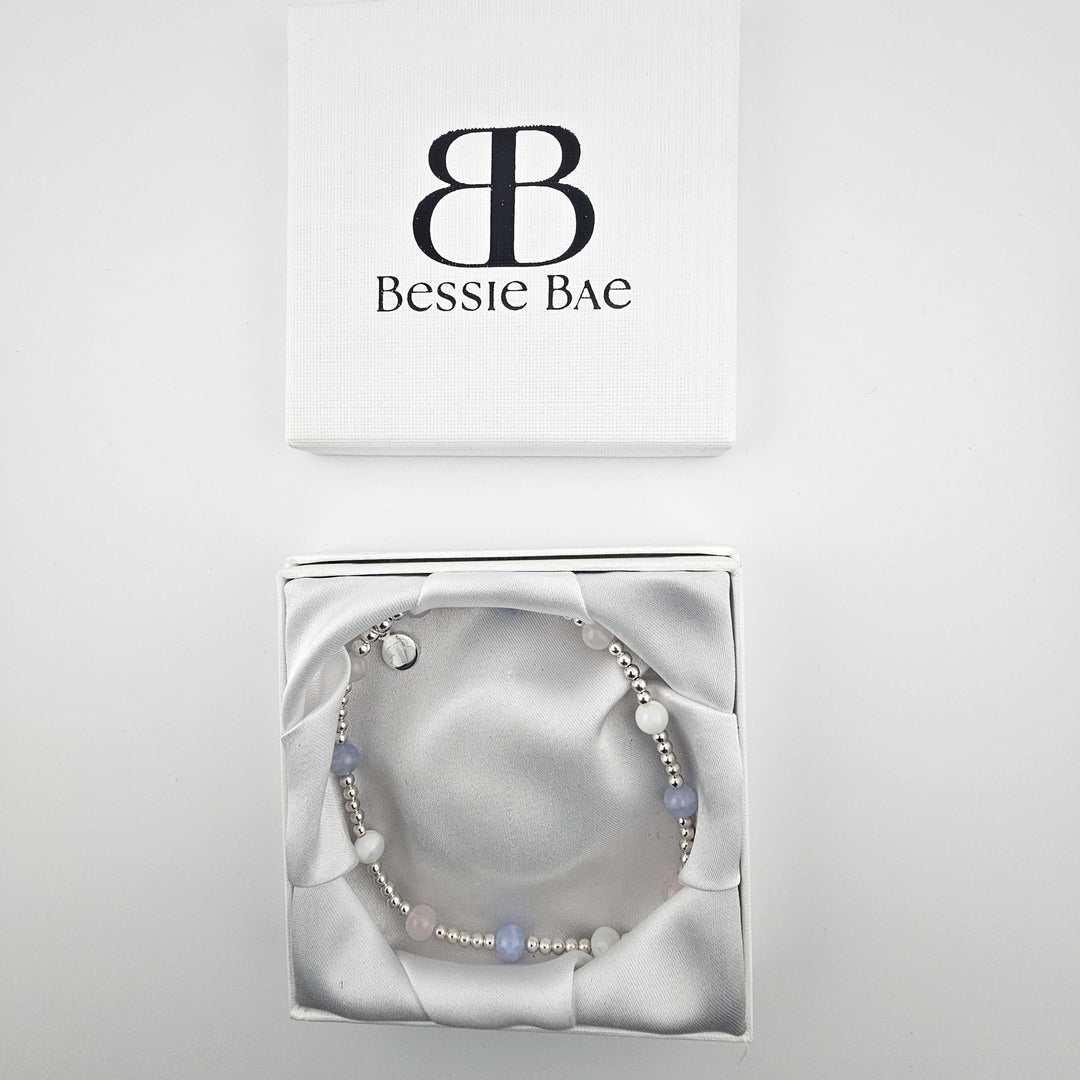 Pastel gemstone anklet displayed in white Bessie Bae gift box.