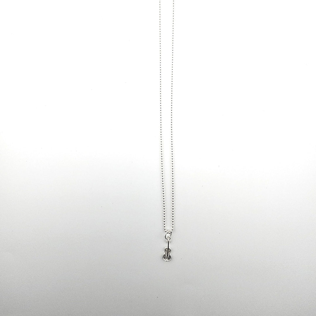 Sterling silver violin necklace by Bessie Bae on a silver ball chain.