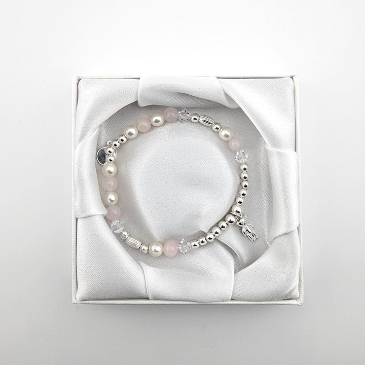 Bessie Bae packaging with Sterling Silver Teddy Bear bracelet presented in white satin box.