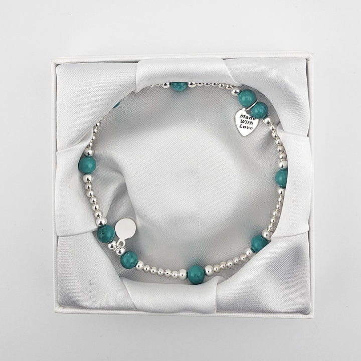 Turquoise beaded sterling silver anklet displayed in Bessie Bae gift box.