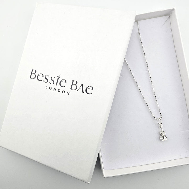 Bessie Bae sterling silver violin necklace with luxury packaging.