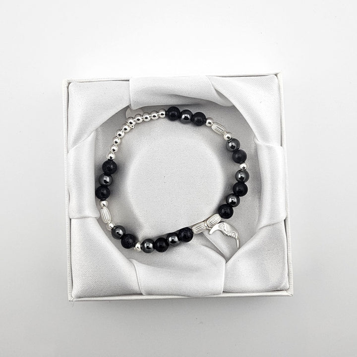 Bessie Bae packaging with Crescent Moon charm bracelet presented in white satin box.