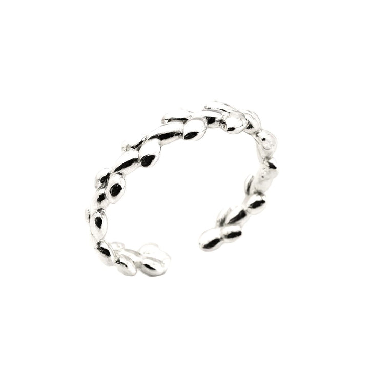 Delicate silver branch ring with leaf details.