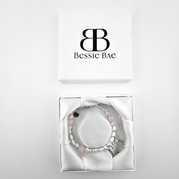 Sterling Silver Dream Explore Discover Bracelet with rose quartz gemstones displayed in Bessie Bae gift box.