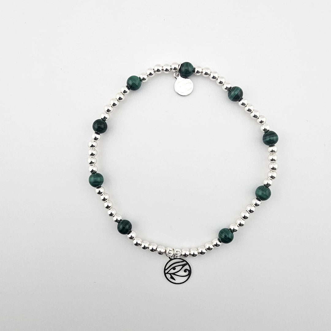 Malachite and sterling silver anklet by Bessie Bae with stretch cord and signature charm.