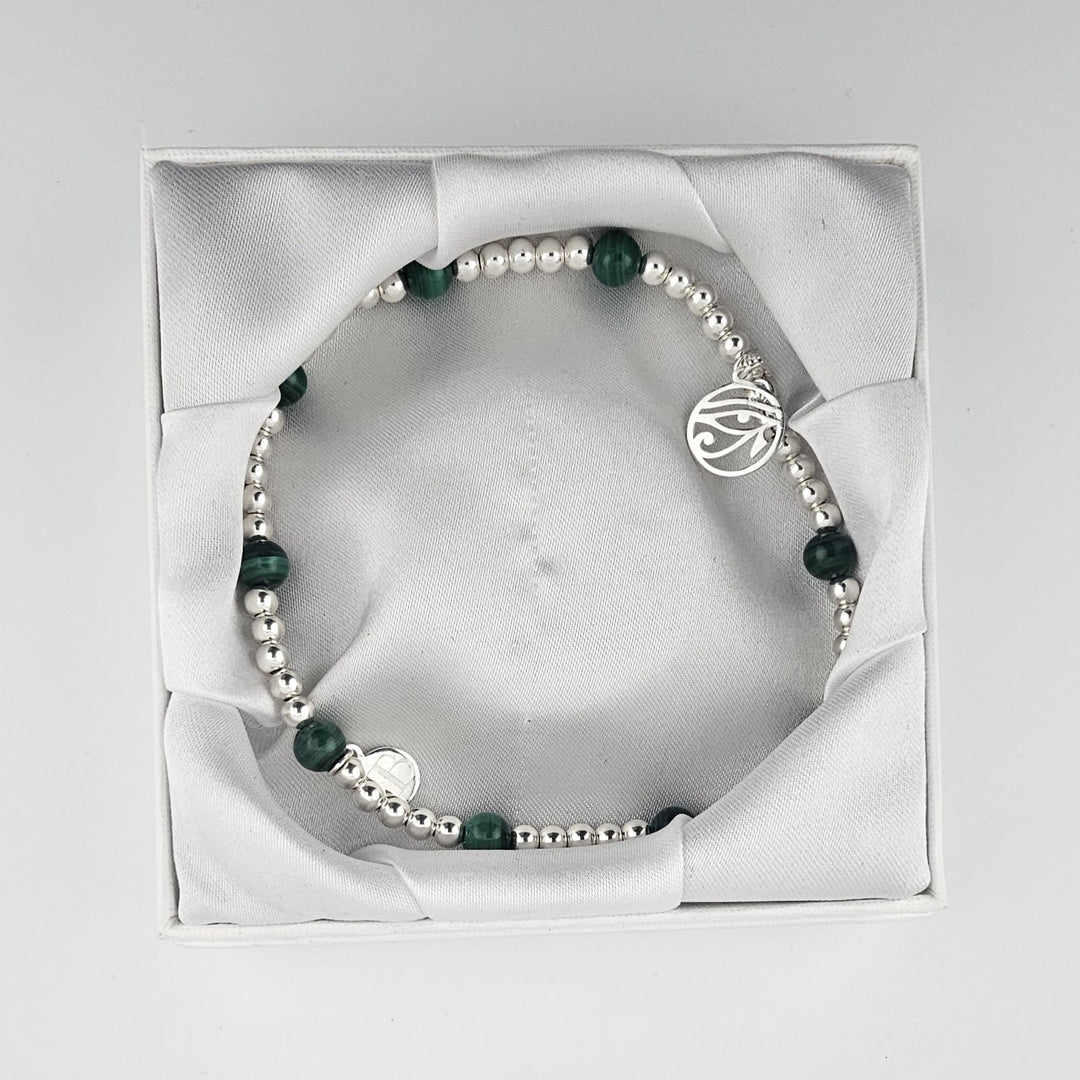 Malachite anklet presented inside luxury Bessie Bae packaging.