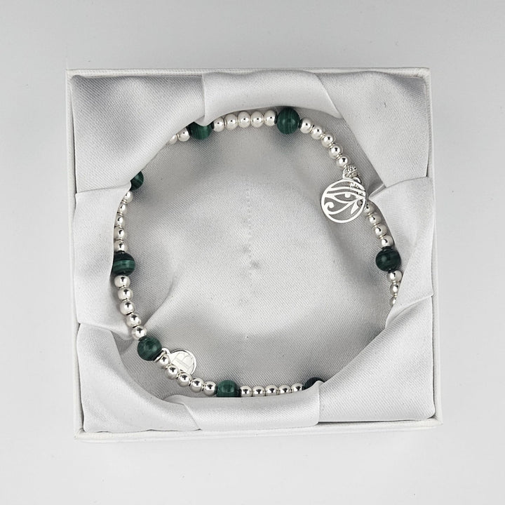 Malachite anklet presented inside luxury Bessie Bae packaging.