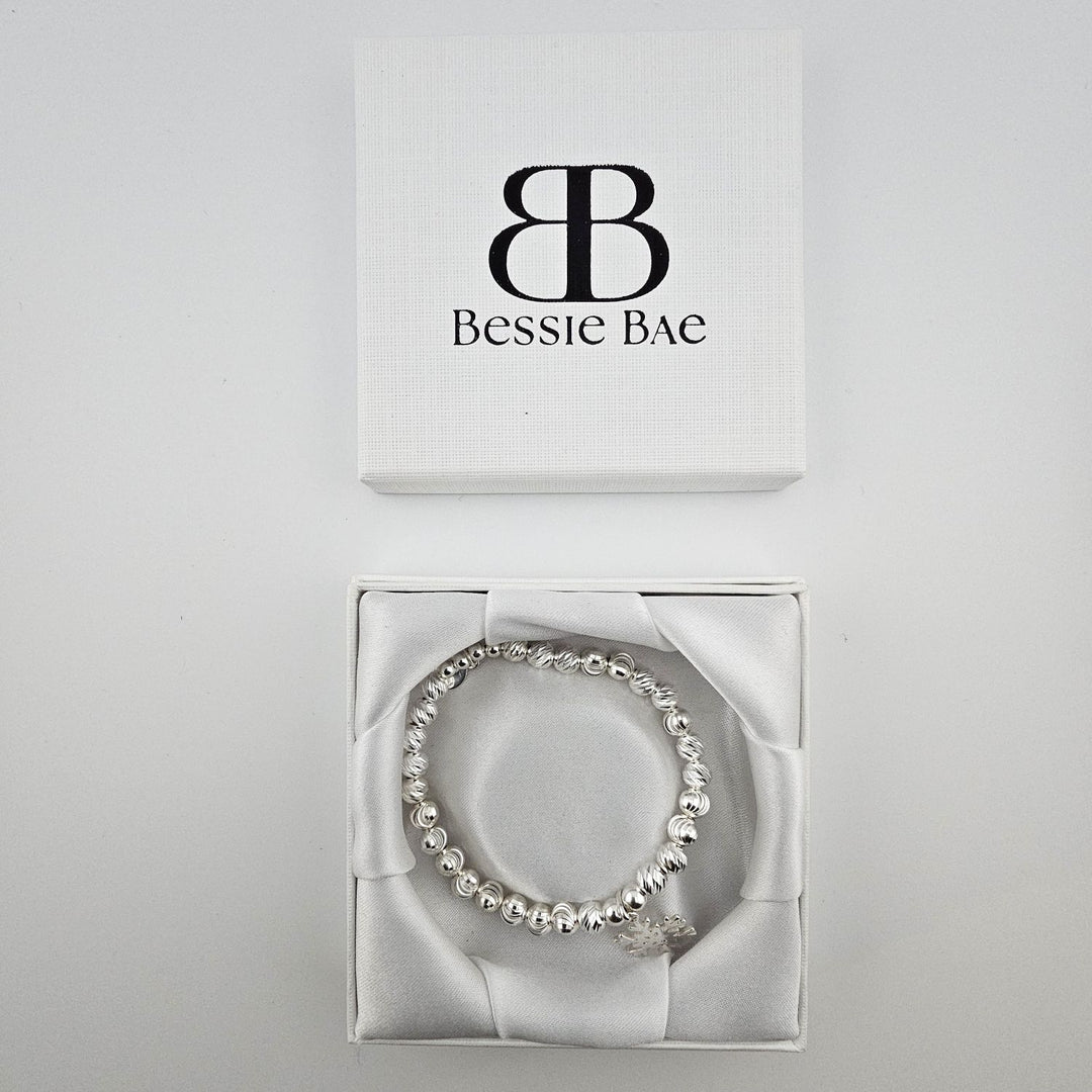Sterling silver beaded snowflake charm bracelet in Bessie Bae gift box.