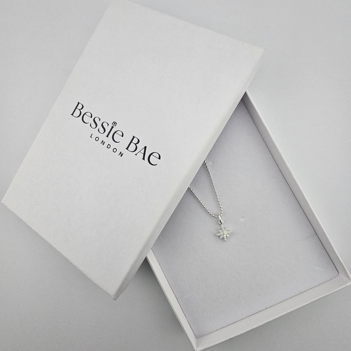 Crystal north star necklace presented in Bessie Bae gift box.