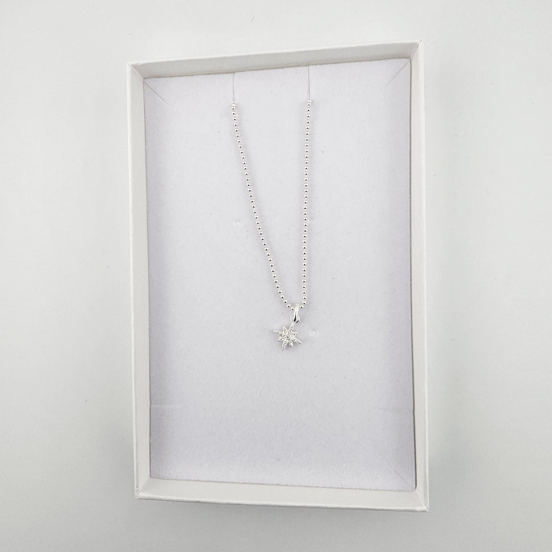 Crystal North Star necklace on beaded chain.