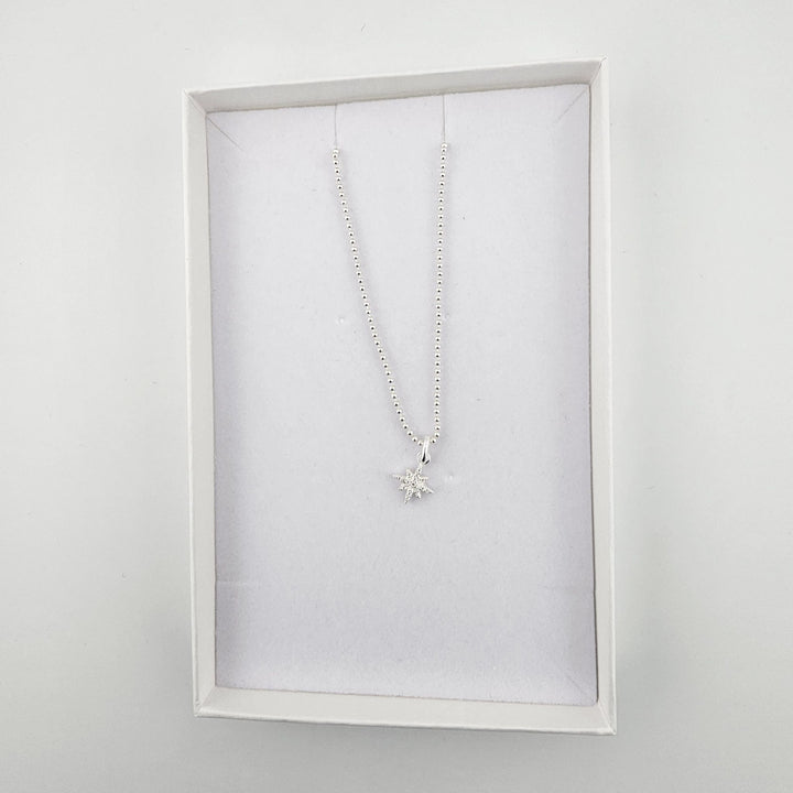 Crystal North Star necklace on beaded chain.