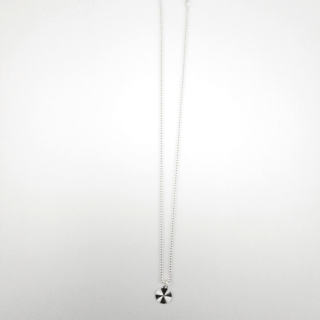 Sterling silver starburst disc necklace with 12mm charm on an 18 inch ball chain.