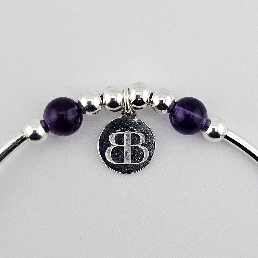 925 sterling silver bracelet with purple amethyst gemstones.