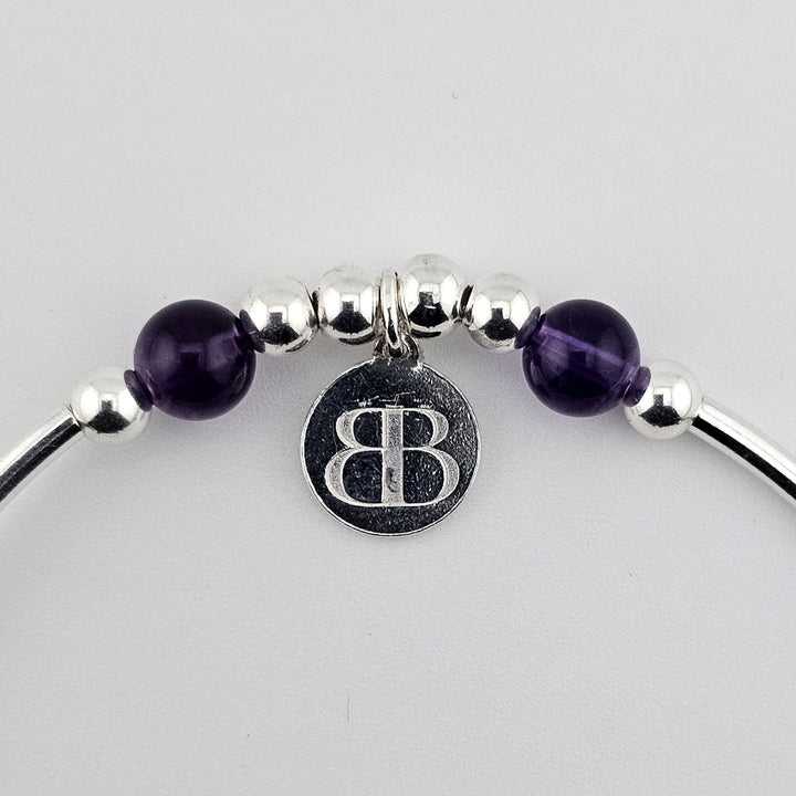925 sterling silver bracelet with purple amethyst gemstones.
