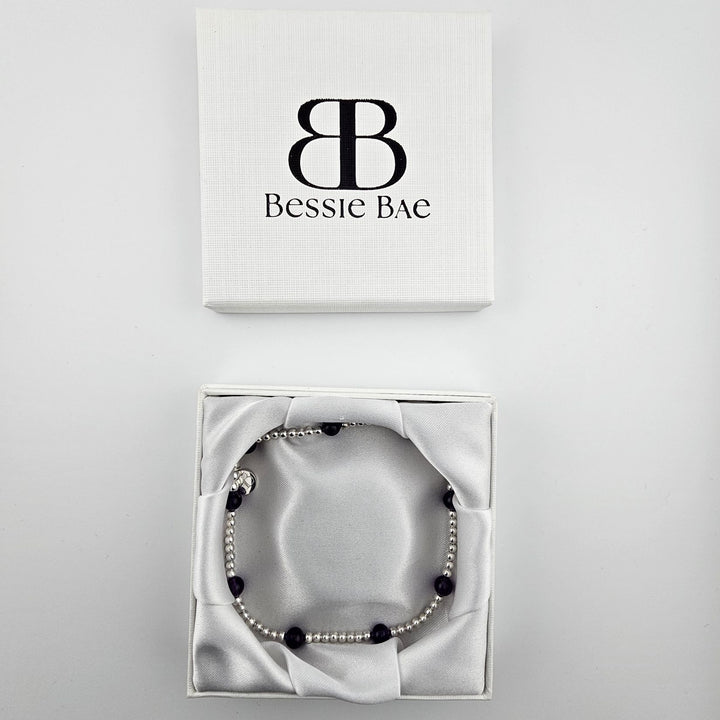 Handmade amethyst gemstone anklet with silver beads.