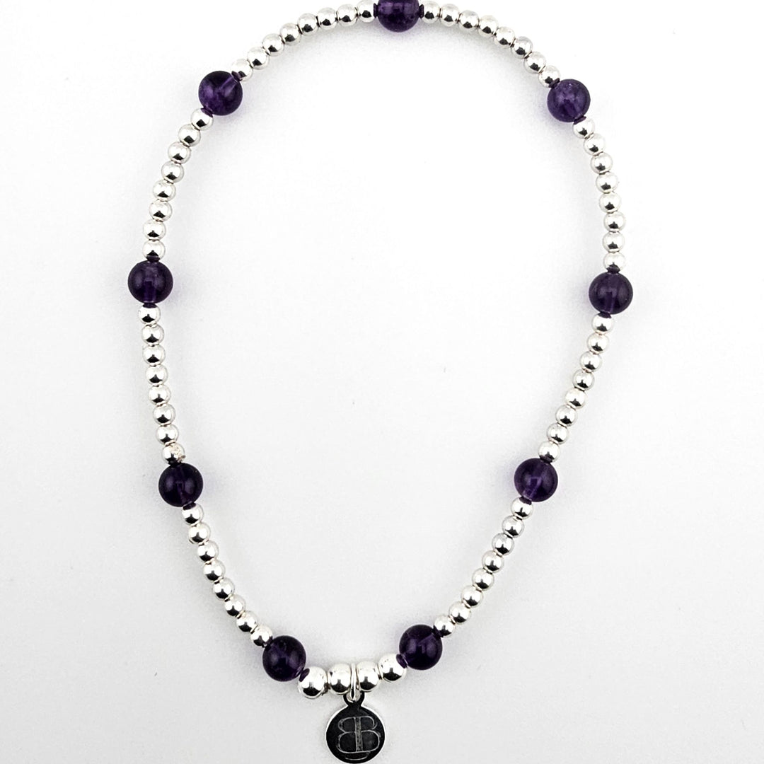 Sterling silver and amethyst beaded stretch anklet.
