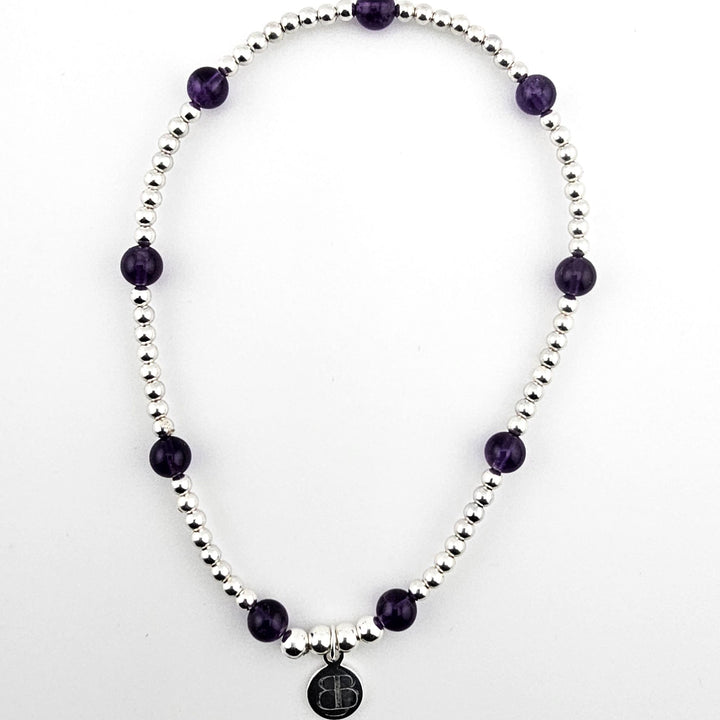 Sterling silver and amethyst beaded stretch anklet.