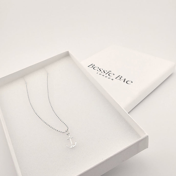 Sterling silver anchor pendant necklace on fine chain in box.