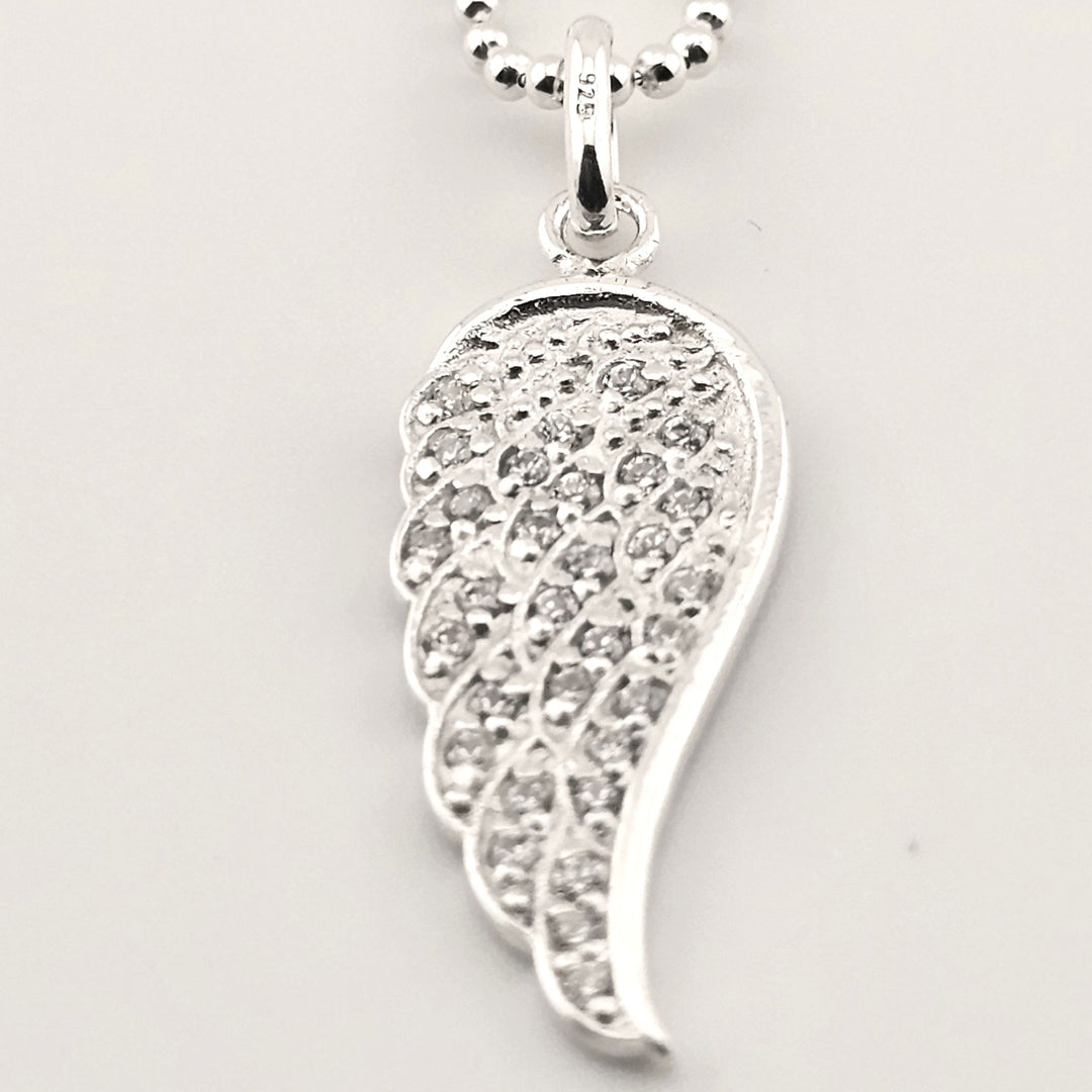 Symbolic sterling silver angel wing necklace for love and protection.