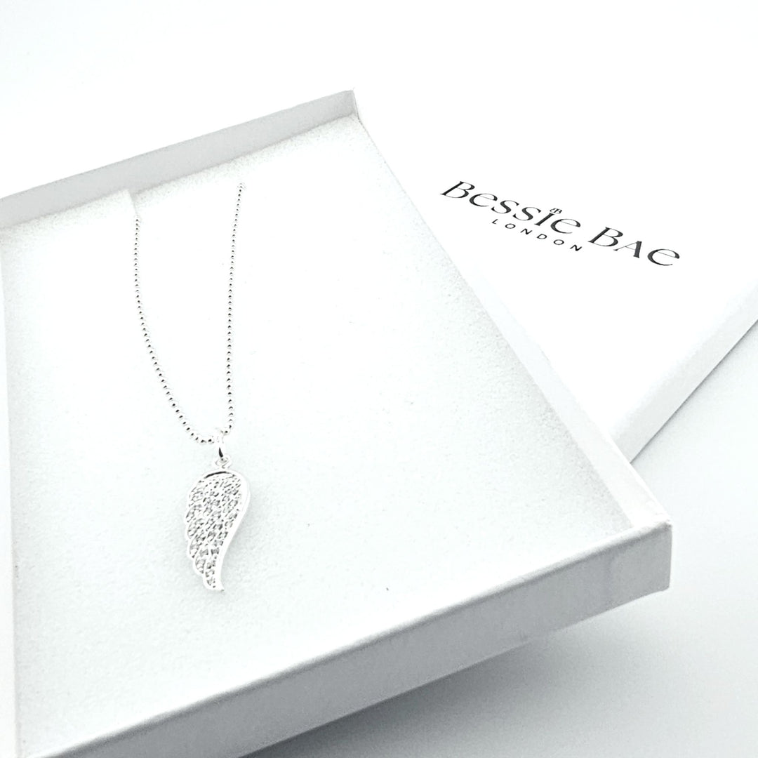 Sterling silver angel wing necklace with cubic zirconia sparkle.