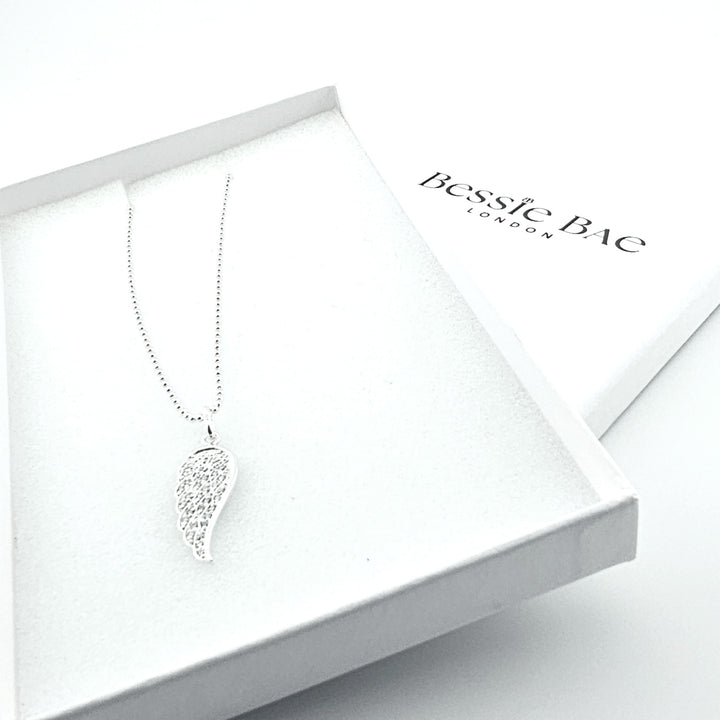Sterling silver angel wing necklace with cubic zirconia sparkle.
