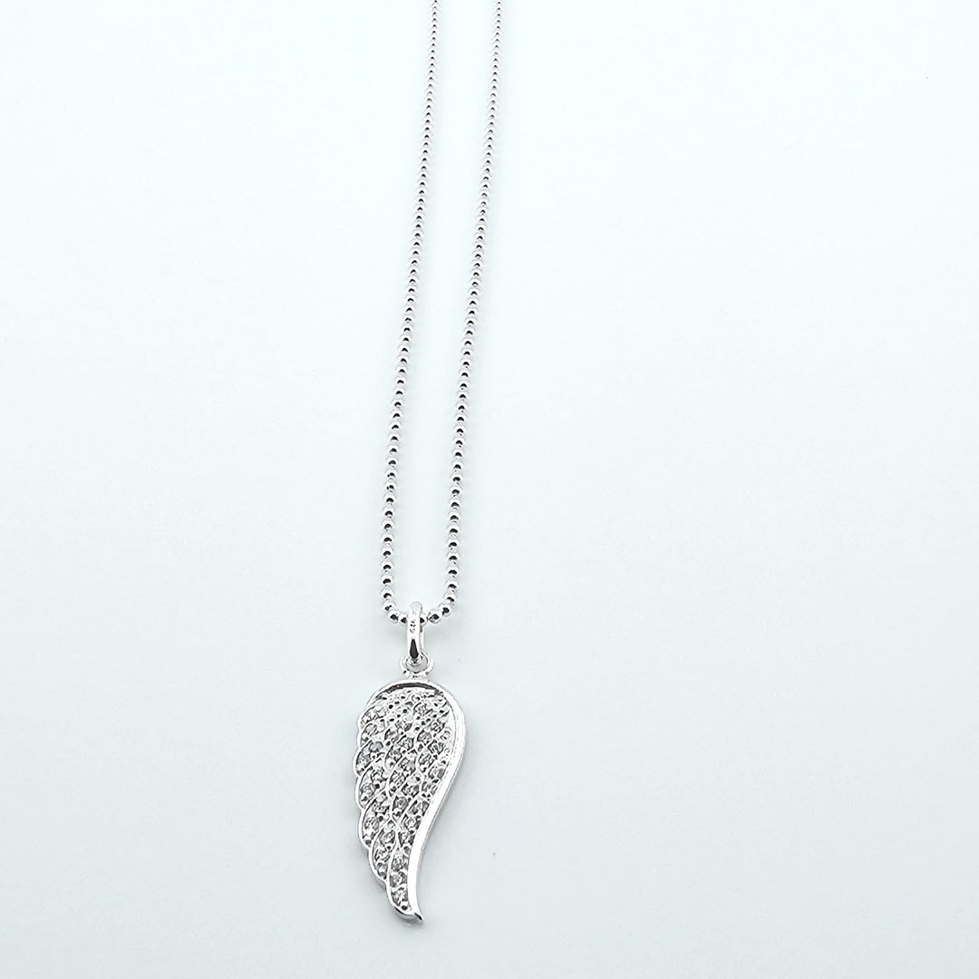 Elegant silver guardian angel wing pendant on fine chain.