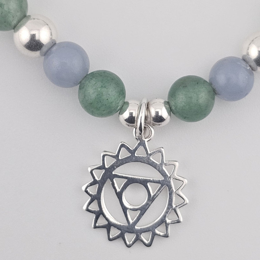 Blue and green gemstone bracelet featuring Third Eye chakra pendant.