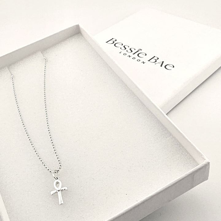 Sterling silver ankh necklace with Egyptian cross of life pendant on fine chain in box.