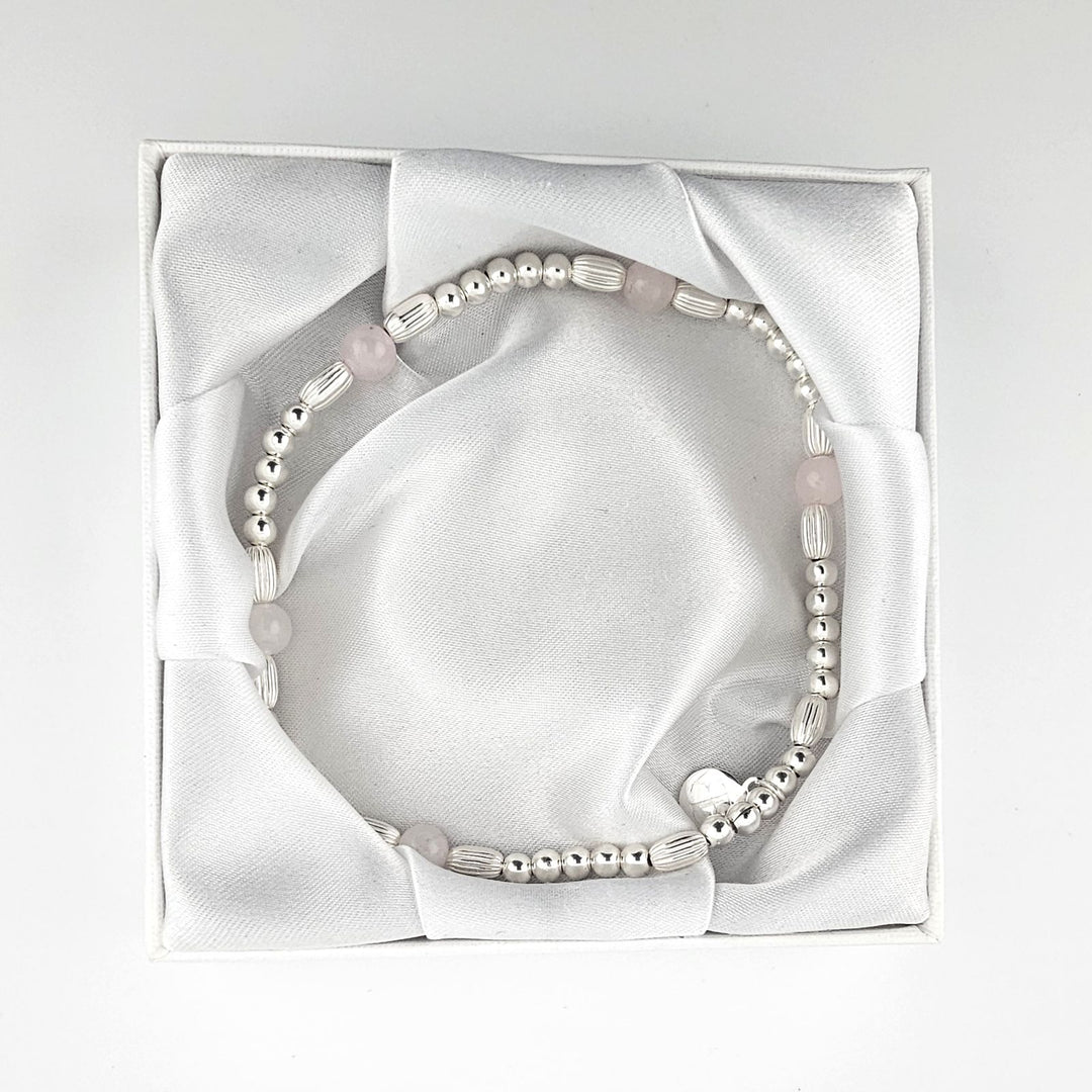 Handmade silver and rose quartz anklet in white silk gift box.