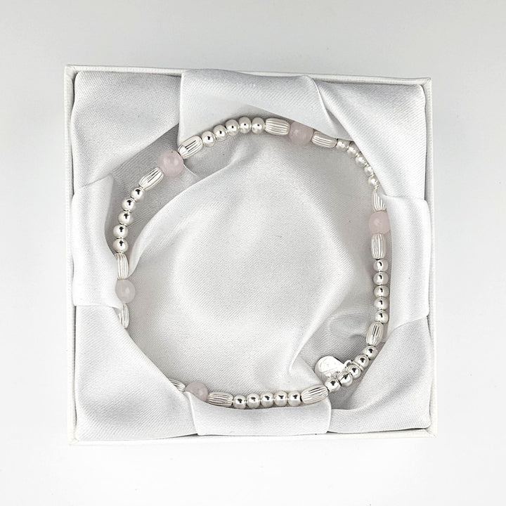 Handmade silver and rose quartz anklet in white silk gift box.