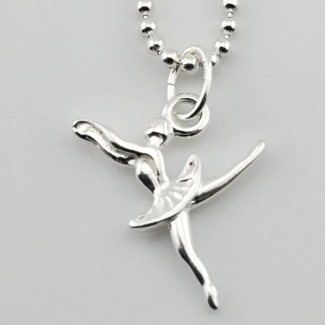 Close-up of sterling silver dancer necklace, ballet-inspired jewellery.