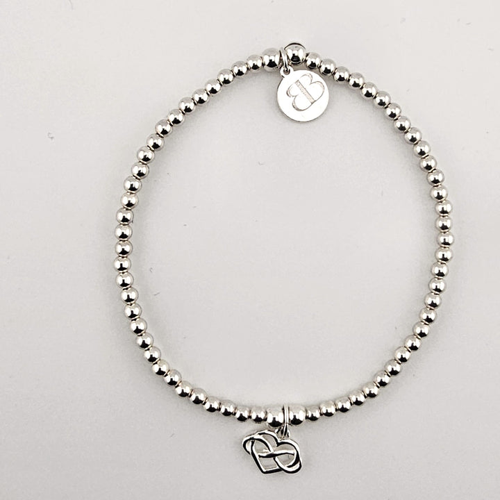 Sterling silver beaded bracelet with infinity heart charm.