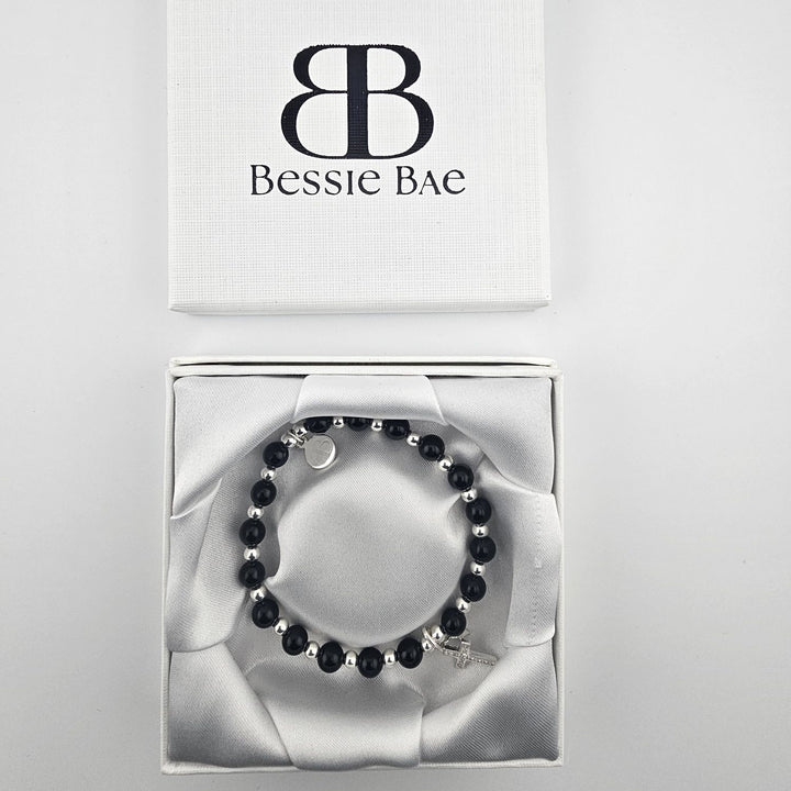 Minimalist Christian jewellery with onyx beads and silver star charm.