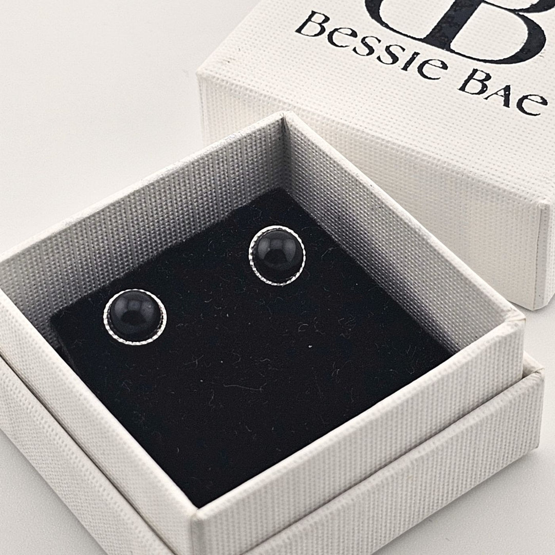 Minimalist sterling silver earrings with natural black onyx.