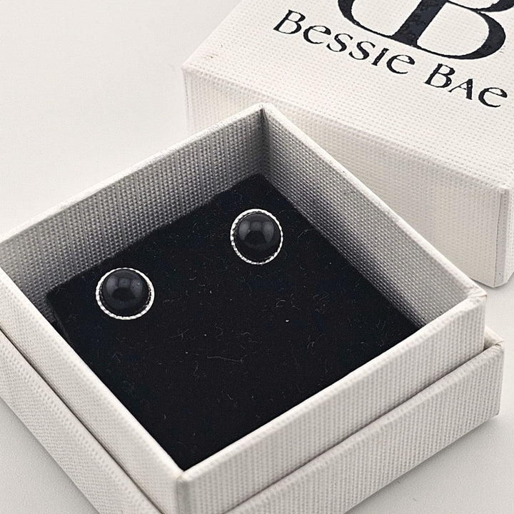 Minimalist sterling silver earrings with natural black onyx.