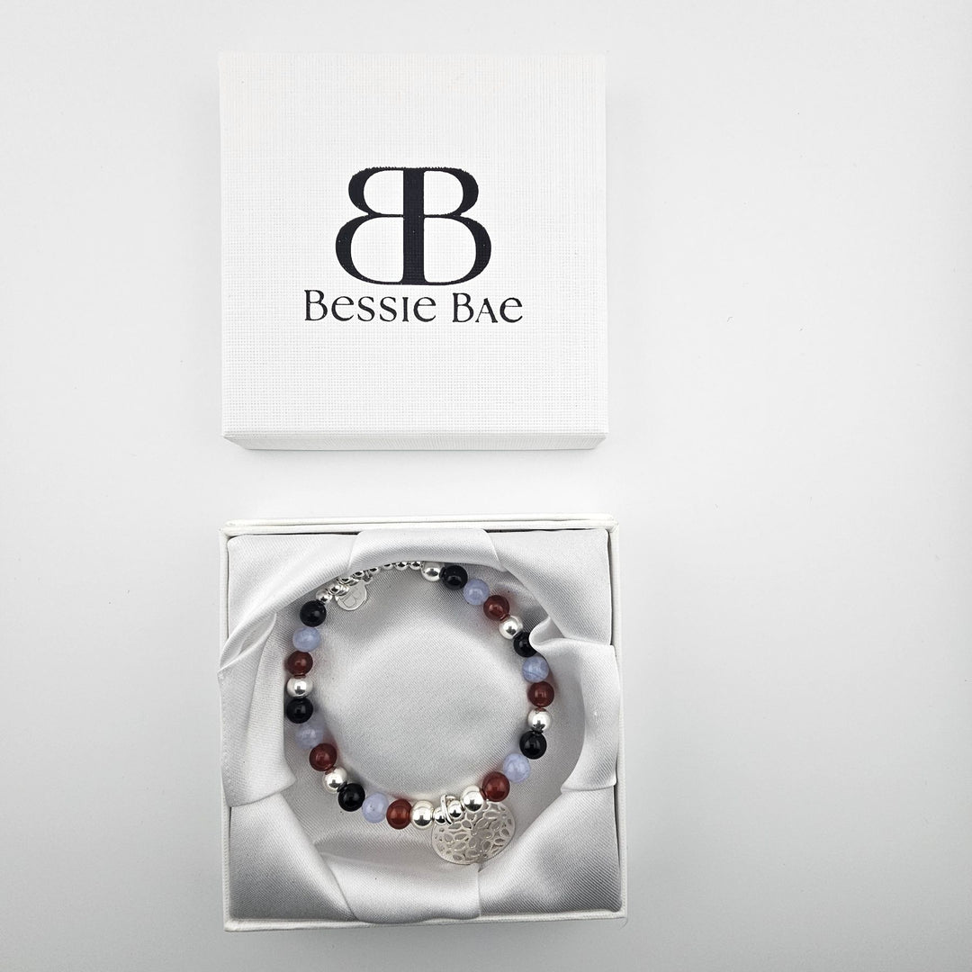 Bohemian gemstone bracelet with sterling silver flower pendant.