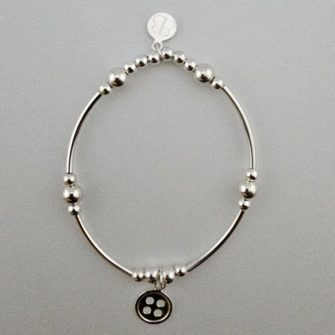 Sterling Silver Button Bracelet handcrafted by Bessie Bae.
