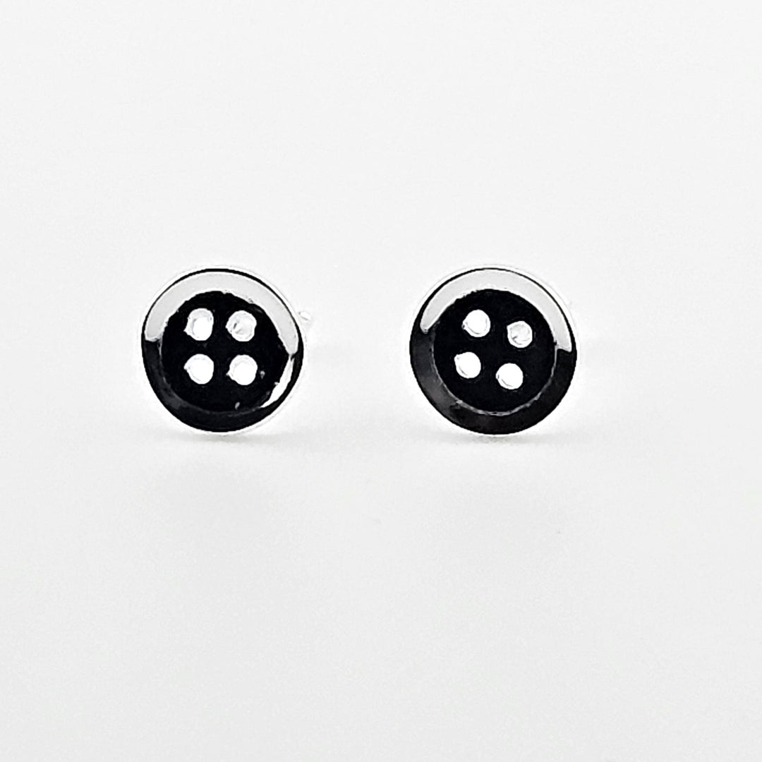 Elegant small button silver stud earrings.