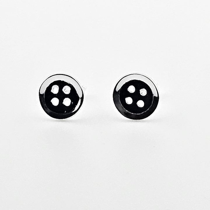 Elegant small button silver stud earrings.