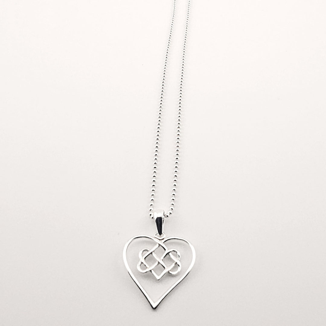 Sterling silver Celtic heart necklace with eternal knot design.