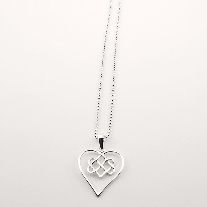 Sterling silver Celtic heart necklace with eternal knot design.